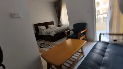 a living room with a couch and a table at Paradise Hill 207 in Hurghada