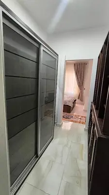 a room with a large glass door with a bedroom at Paradise Hill 207 in Hurghada