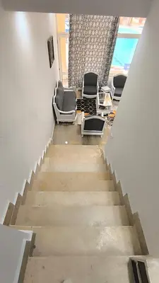a stairway with chairs and a room with a window at Paradise Hill 207 in Hurghada