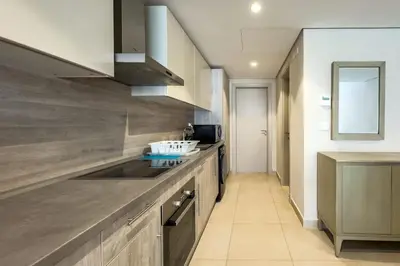 a kitchen with a sink and a counter top at Remarkable & Rare 2BDR Mangroovy Free Pool & Beach in Hurghada