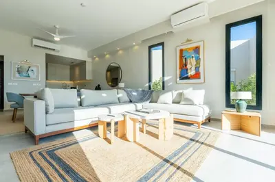 a living room with a couch and a table at Modern luxury villa in SomaBay in Hurghada