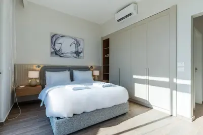 a bedroom with a large bed and a closet at Modern luxury villa in SomaBay in Hurghada