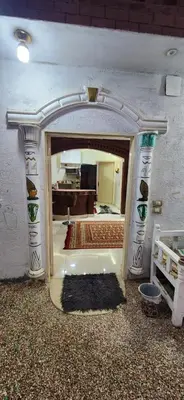 an entrance to a room with an archway in a building at Little Private Palace in Luxor in Luxor