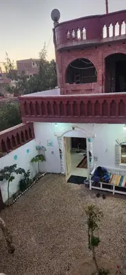a building with a large brick building with a courtyard at Little Private Palace in Luxor in Luxor