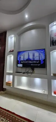 a flat screen tv on a wall in a room at Little Private Palace in Luxor in Luxor