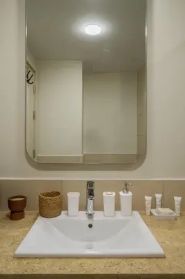 a bathroom with a sink with a mirror at Gouna Getaway in Hurghada
