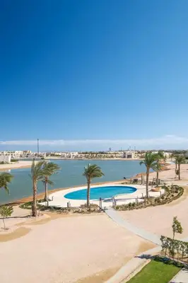 an aerial view of a beach with palm trees at Gouna Getaway in Hurghada