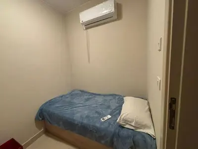 a small room with a bed and a air conditioner at El gouna mangrouovy in Hurghada