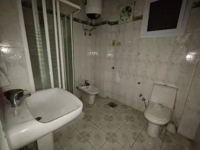 a bathroom with a sink and a toilet at جبل تقوق فيلا عبدالله محروس in Aswan