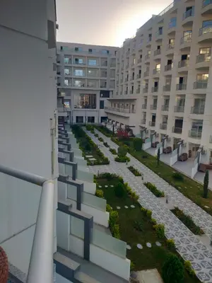 a large building with a pathway in front of a building at Scandic resort hurghada in Hurghada