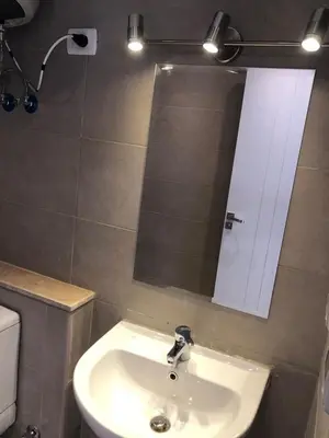 a bathroom with a sink and a mirror at Luxury stay in El Gouna