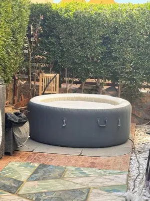 a large round hot tub sitting on a patio at The getaway in Hurghada