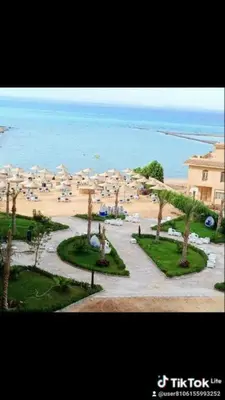 a view of a resort with umbrellas and the ocean at Hurghada Fiesta Resort Studio 323 in Hurghada