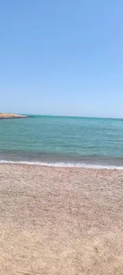 a sandy beach with the ocean in the background at Hurghada Fiesta Resort Studio 323 in Hurghada