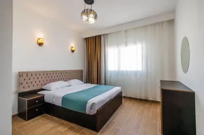 a hotel room with a bed and a window at Al Saraya Sahl Hasheesh by Peak -One-Bedroom Apartment C316 in Hurghada