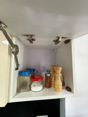 a shelf in a kitchen with food items on it at Exquisite 1BR Chalet with Pool and Beach Front El Gouna in Hurghada