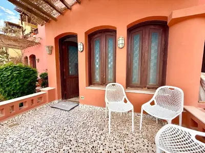a group of chairs sitting on a patio at Exquisite 1BR Chalet with Pool and Beach Front El Gouna in Hurghada