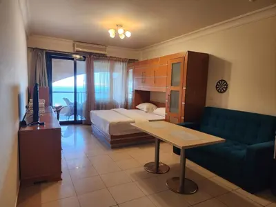 a hotel room with a bed and a couch at Studio for rent in Hurghada 116 in Hurghada