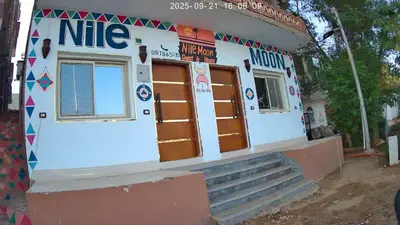 a small building with a nite sign on it at Nile Moon in Jazīrat Aswān