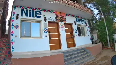 a building with a nike sign on the side of it at Nile Moon in Jazīrat Aswān