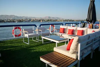 a group of chairs and tables on the back of a boat at Renaissance Nile Cruise - Every Saturday from Luxor To Aswan for 4 Nights , and every Wednesday from Aswan To Luxor for 3 Nights in Luxor