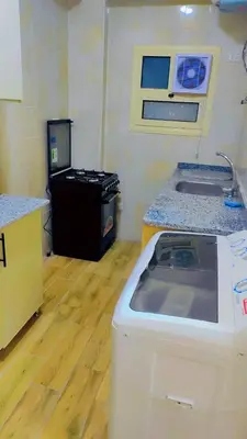 a kitchen with a counter and a sink in a room at Hurghada in Hurghada