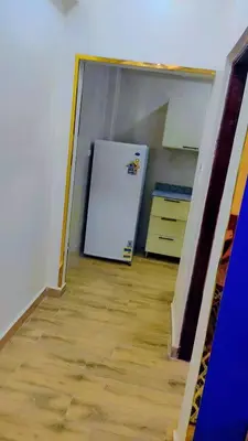a kitchen with a white refrigerator in a room at Hurghada in Hurghada