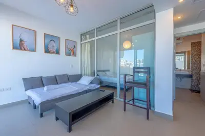 a living room with a couch and a table at Modern 1BR with Pool View in Sholan El Gouna in Hurghada