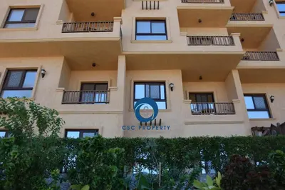 a building with a sign on the side of it at Impeccable 1-Bed Apartment in Hurghada in Hurghada
