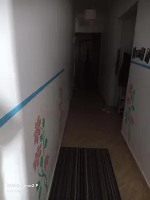 a hallway with a wall with flowers painted on it at happy vacation in Hurghada