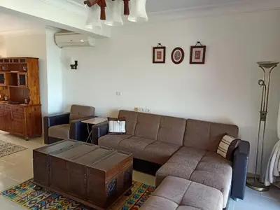 a living room with a couch and a coffee table at Sea View Hurghada Holiday Home in Hurghada