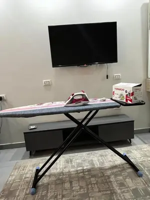 a desk with a tv on top of it at Scandic Resort Hurghada in Hurghada