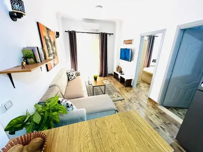 a living room with a couch and a table at Cleopatra Style City Center in Hurghada