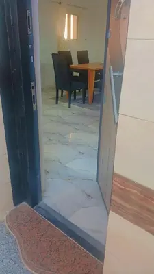 an open door to a dining room with a table at أهلا بكم in Luxor
