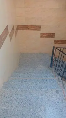 an empty room with a staircase in a room with wood at أهلا بكم in Luxor