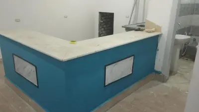 a blue counter top in a bathroom with a toilet at منزل خاص غرفتين 2 حمام صاله مطبخ امريكي جنينه خاصه سلم خارجي رووڤ in Al Aqālitah