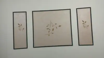 four picture frames hanging on a wall at منزل خاص غرفتين 2 حمام صاله مطبخ امريكي جنينه خاصه سلم خارجي رووڤ in Al Aqālitah