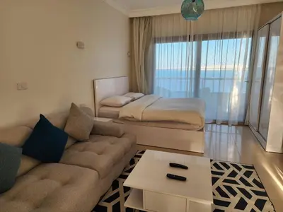 a living room with a bed and a couch at Studil for rent in the view 608 in Hurghada
