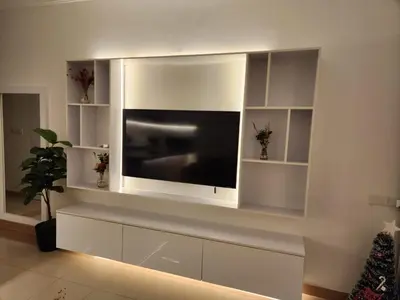 a living room with a large flat screen tv on a wall at Studio for rent in the view 607 in Hurghada
