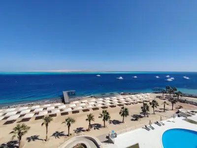an aerial view of a beach with umbrellas and the ocean at Studio for rent in the view 607 in Hurghada