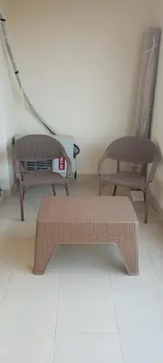 two chairs and a bench in a room at Florenza Resort in Hurghada