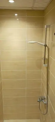 a bathroom with a shower with a glass door at Florenza Resort in Hurghada