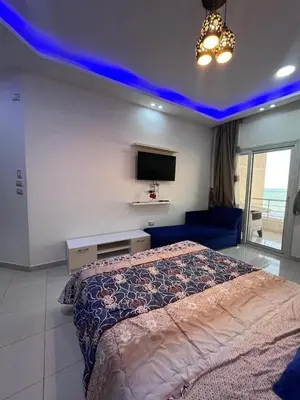 a bedroom with a bed and a blue ceiling at Casablanca Beach for families only in Hurghada