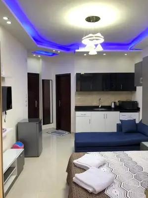 a living room with a blue led ceiling at Casablanca Beach for families only in Hurghada