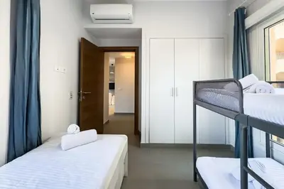 a room with two bunk beds and a hallway at The 2BDR Warmhearted Waterside Apt in Hurghada