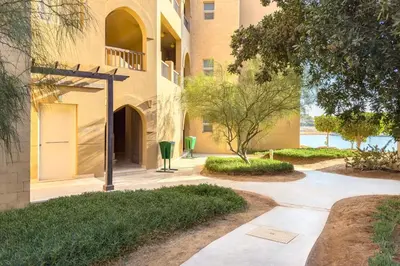a walkway in front of a building at The 2BDR Warmhearted Waterside Apt in Hurghada