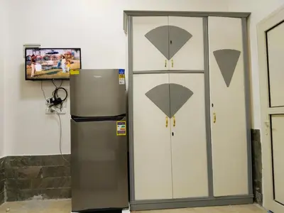 a refrigerator next to a wall with umbrellas on it at الغردقه منطقه الاحياء in Hurghada