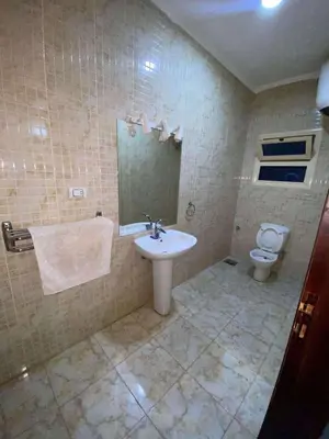 a bathroom with a sink and a toilet at Villa with private pool A F in Hurghada