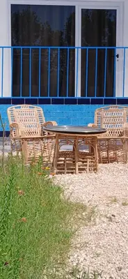 a picnic table and chairs in front of a building at Studio House Luxor in Luxor