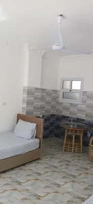 a living room with a couch and a table at Studio House Luxor in Luxor